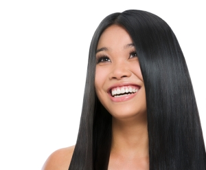 Beauty portrait of smiling asian girl healthy long straight hair isolated on white